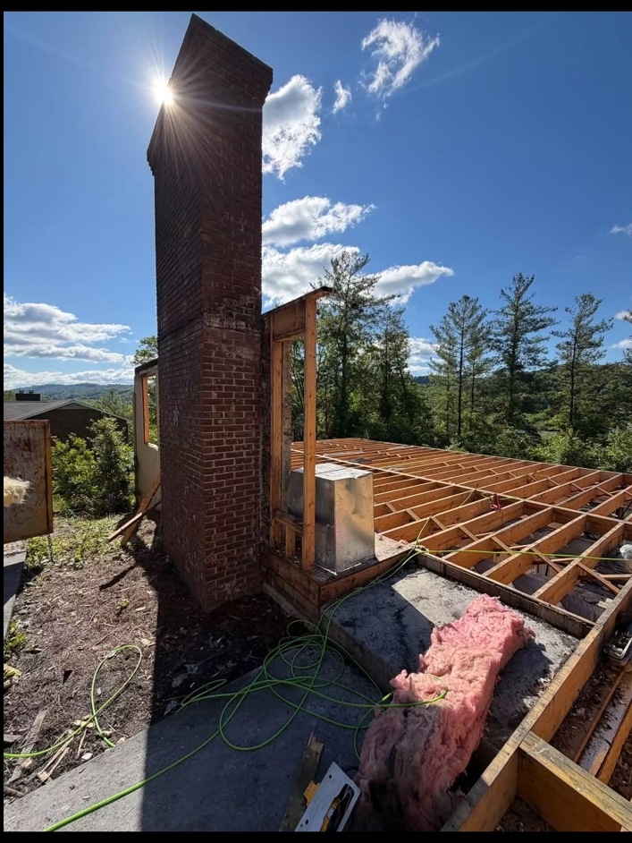 Structural construction around an existing chimney
